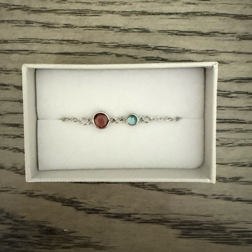 Elegant Silver Bracelet with Red and Blue Stones